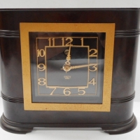 c1920/30s Art Deco Smiths Sectric clock in brown bakelite case with curved shape and gilt framed face - Sold for $61 - 2015
