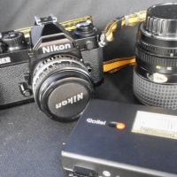 Group lot - Vintage Nikon F2 35 mm film camera with Nikon 50mm 18 and Tokina 28-85 35-45 lenses, Rollei Flash, bag and accessories - Sold for $122 - 2015