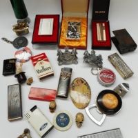 Box lot mixed blokey items inc - car badges, cigarette lighters, keyrings, etc - Sold for $30 - 2015