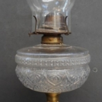 c1900 oil lamp with black metal base, milk glass stem and clear glass font and chimney - Sold for $61 - 2015