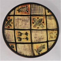Small CARL COOPER Australian pottery dish with painted Aboriginal motif of crossed shield, incised signature to base Cooper - 9cm D - Sold for $161 - 2019